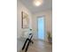 Bright entryway featuring modern decor, a glass table, and plenty of natural light at 5105 68Th N Way, St Petersburg, FL 33709