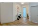 Bright entryway with a modern console table, a sleek design, and wood-look floors at 5105 68Th N Way, St Petersburg, FL 33709