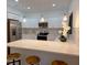 Stylish kitchen featuring stainless steel appliances, white cabinetry, and a breakfast bar with seating at 5105 68Th N Way, St Petersburg, FL 33709