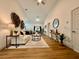 Bright living room featuring modern decor, wood-look floors, and an open floor plan at 5105 68Th N Way, St Petersburg, FL 33709