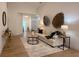 Inviting living room with neutral tones, decorative accents, and wood-look floors at 5105 68Th N Way, St Petersburg, FL 33709
