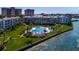 Aerial view of community buildings, pool, and waterfront at 5155 Isla Key S Blvd # 304, St Petersburg, FL 33715