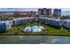 Aerial view of the community with landscaped grounds, pool, and waterfront views at 5155 Isla Key S Blvd # 304, St Petersburg, FL 33715