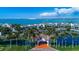 Stunning aerial view of beachfront condos with palm trees and beautiful water views at 5155 Isla Key S Blvd # 304, St Petersburg, FL 33715
