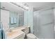 Neutral bathroom featuring a sliding glass shower door and updated vanity at 5155 Isla Key S Blvd # 304, St Petersburg, FL 33715