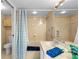 Well-lit bathroom with a shower and tub combination and neutral finishes at 5155 Isla Key S Blvd # 304, St Petersburg, FL 33715