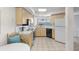 Efficient kitchen featuring white appliances and tile floors with water views at 5155 Isla Key S Blvd # 304, St Petersburg, FL 33715