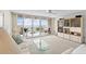 Inviting living room featuring waterfront views and a large glass sliding door to the balcony at 5155 Isla Key S Blvd # 304, St Petersburg, FL 33715