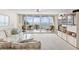 Bright living room showcasing waterfront views and a sliding door to the balcony at 5155 Isla Key S Blvd # 304, St Petersburg, FL 33715