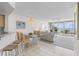 Bright, open floor plan connects the kitchen, dining area, living room, and balcony with water views at 5155 Isla Key S Blvd # 304, St Petersburg, FL 33715