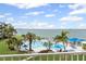 Community pool and sunbathing area with ocean views from the balcony at 5155 Isla Key S Blvd # 304, St Petersburg, FL 33715