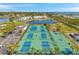 Community tennis courts and lake provide recreational opportunities amidst serene surroundings at 5240 Coquina Key Se Dr # B, St Petersburg, FL 33705