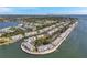 Stunning aerial view of a waterfront community featuring canals and lush landscaping, offering a picturesque residential setting at 5240 Coquina Key Se Dr # B, St Petersburg, FL 33705