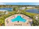 Relaxing pool area is surrounded by lush landscaping and lounge chairs, providing a serene escape at 5240 Coquina Key Se Dr # B, St Petersburg, FL 33705