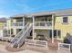 Charming two-story condo featuring dual balconies, outdoor patio and staircase access at 5240 Coquina Key Se Dr # B, St Petersburg, FL 33705