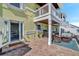 Charming two-story waterfront home with outdoor patio, balcony, and stairs leading to upper-level, perfect for outdoor enjoyment at 5240 Coquina Key Se Dr # B, St Petersburg, FL 33705