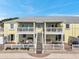 Charming two-story condominium complex featuring balconies and outdoor patios with stairs to the upper level, offering great outdoor living at 5240 Coquina Key Se Dr # B, St Petersburg, FL 33705