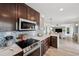 Stylish kitchen showcasing modern appliances, ample counter space, and seamless flow into the living area at 5240 Coquina Key Se Dr # B, St Petersburg, FL 33705