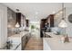 Bright, modern kitchen with quartz countertops, tile backsplash and stainless steel appliances at 5240 Coquina Key Se Dr # B, St Petersburg, FL 33705