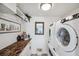 Laundry room featuring side by side washer and dryer, and granite countertops at 5240 Coquina Key Se Dr # B, St Petersburg, FL 33705