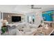 Bright and airy living room featuring modern décor, large windows, and comfortable seating at 5240 Coquina Key Se Dr # B, St Petersburg, FL 33705