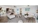Inviting living room with plush sofa, modern accents, and open floor plan at 5240 Coquina Key Se Dr # B, St Petersburg, FL 33705