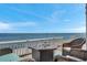 Outdoor patio area with comfortable seating, fire pit, and stunning waterfront views at 5240 Coquina Key Se Dr # B, St Petersburg, FL 33705