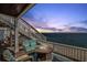 Relaxing waterfront patio at twilight, complete with comfortable seating and a cozy fire pit for serene evenings at 5240 Coquina Key Se Dr # B, St Petersburg, FL 33705