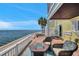Inviting waterfront patio features comfortable seating, a fire pit, and breathtaking water views, perfect for relaxing and enjoying at 5240 Coquina Key Se Dr # B, St Petersburg, FL 33705