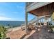 Spacious waterfront patio featuring outdoor dining and stairs to the upper level, perfect for enjoying serene water views at 5240 Coquina Key Se Dr # B, St Petersburg, FL 33705