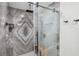 Shower with decorative tile and seamless glass doors, featuring rain-style shower head at 5240 Coquina Key Se Dr # B, St Petersburg, FL 33705