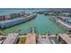 Aerial view showcasing waterfront condos and boat docks with access to the bay at 5960 30Th S Ave # 414, Gulfport, FL 33707