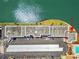 Aerial view of building showing proximity to green space and parking at 5960 30Th S Ave # 414, Gulfport, FL 33707