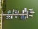 Aerial view of a boat dock showcasing multiple boats and surrounding tranquil waters at 5960 30Th S Ave # 414, Gulfport, FL 33707