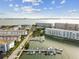 Expansive aerial view of waterfront condos with boat docks and convenient parking at 5960 30Th S Ave # 414, Gulfport, FL 33707
