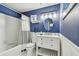 Updated bathroom with a modern vanity, nautical decor, and shower/tub combo at 5960 30Th S Ave # 414, Gulfport, FL 33707