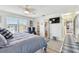 Bright bedroom with ensuite bathroom, closet, ceiling fan, and water view at 5960 30Th S Ave # 414, Gulfport, FL 33707
