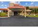 Inviting clubhouse entrance featuring covered drop-off, with benches and bike racks at 5960 30Th S Ave # 414, Gulfport, FL 33707