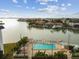 Relaxing community pool area overlooking a tranquil waterfront setting with boat docks at 5960 30Th S Ave # 414, Gulfport, FL 33707