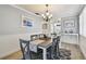 Open dining area with decorative light fixture that connects to the kitchen at 5960 30Th S Ave # 414, Gulfport, FL 33707