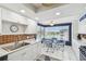 Bright kitchen features white cabinets and a dining area with expansive water views at 5960 30Th S Ave # 414, Gulfport, FL 33707