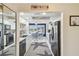 Bright kitchen features white cabinets, modern appliances, and dining area with water view at 5960 30Th S Ave # 414, Gulfport, FL 33707