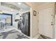 Bright kitchen features white cabinets, modern appliances, and dining area with water view at 5960 30Th S Ave # 414, Gulfport, FL 33707