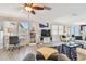 Open-concept living room with desk, TV, and comfortable seating at 5960 30Th S Ave # 414, Gulfport, FL 33707