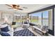 Bright living room boasts water views, stylish furnishings and a ceiling fan at 5960 30Th S Ave # 414, Gulfport, FL 33707