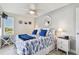 Charming bedroom features stylish, nautical themed bedding, ceiling fan and a large window at 5960 30Th S Ave # 414, Gulfport, FL 33707