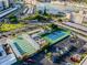 Aerial view of community tennis courts and recreational area with ample parking spaces at 5960 30Th S Ave # 414, Gulfport, FL 33707