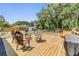 Back deck with outdoor seating, perfect for entertaining or relaxing at 6821 Mary Lou Ln, Wesley Chapel, FL 33544