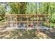 Chicken coop on a well-maintained backyard property at 6821 Mary Lou Ln, Wesley Chapel, FL 33544