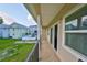 Private outdoor balcony offering scenic views of the backyard and neighborhood at 6822 Kissimmee St # 8-B, Tampa, FL 33616